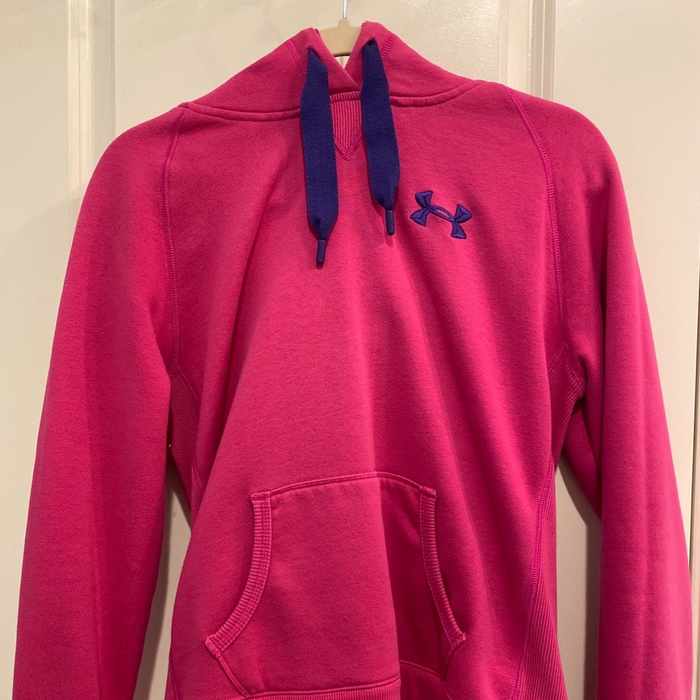 a pink under armer sweatshirt w/ purple strings
